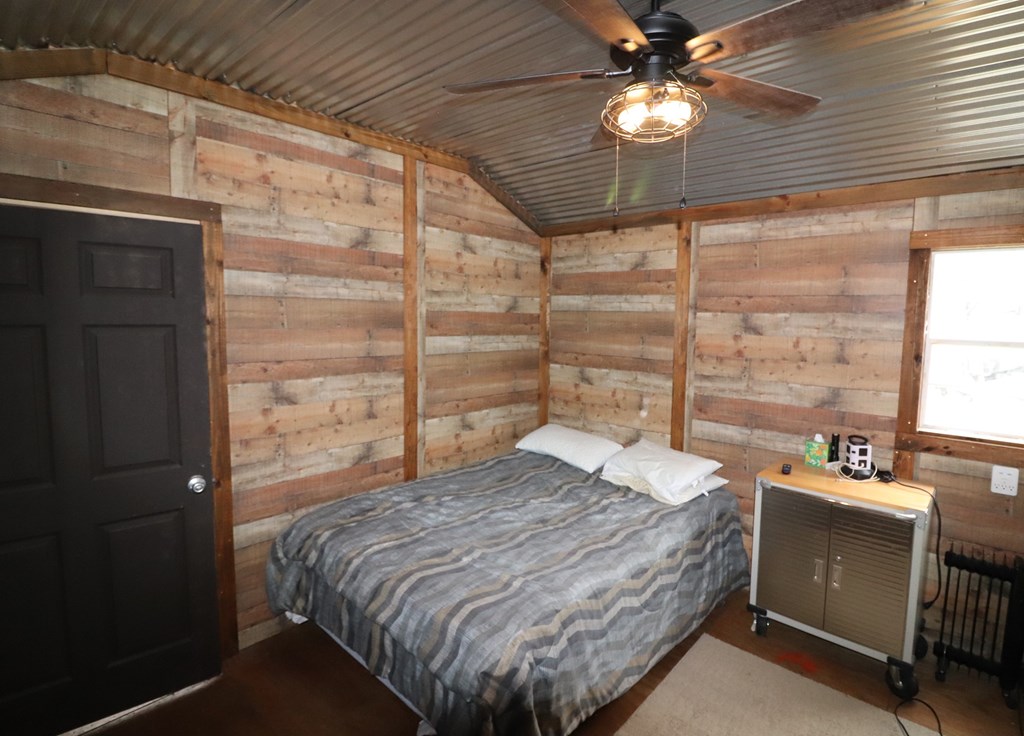 2 Sd 45682 Rocksprings, TX 78880 - Photo 66 of 72 a bedroom with a bed and a chandelier