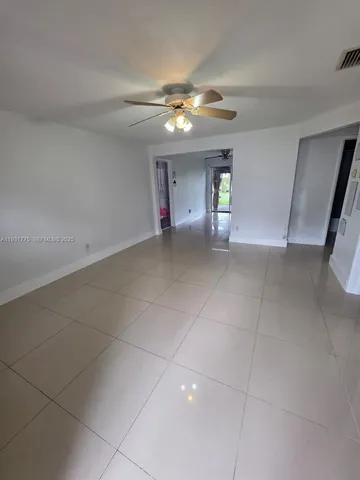 a view of an empty room with a bathroom