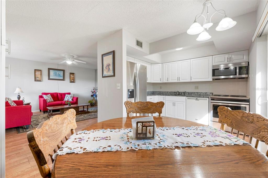 25 Quails Run Boulevard, Unit 6 Englewood, FL 34223 - Photo 15 of 31 a living room with furniture and kitchen view