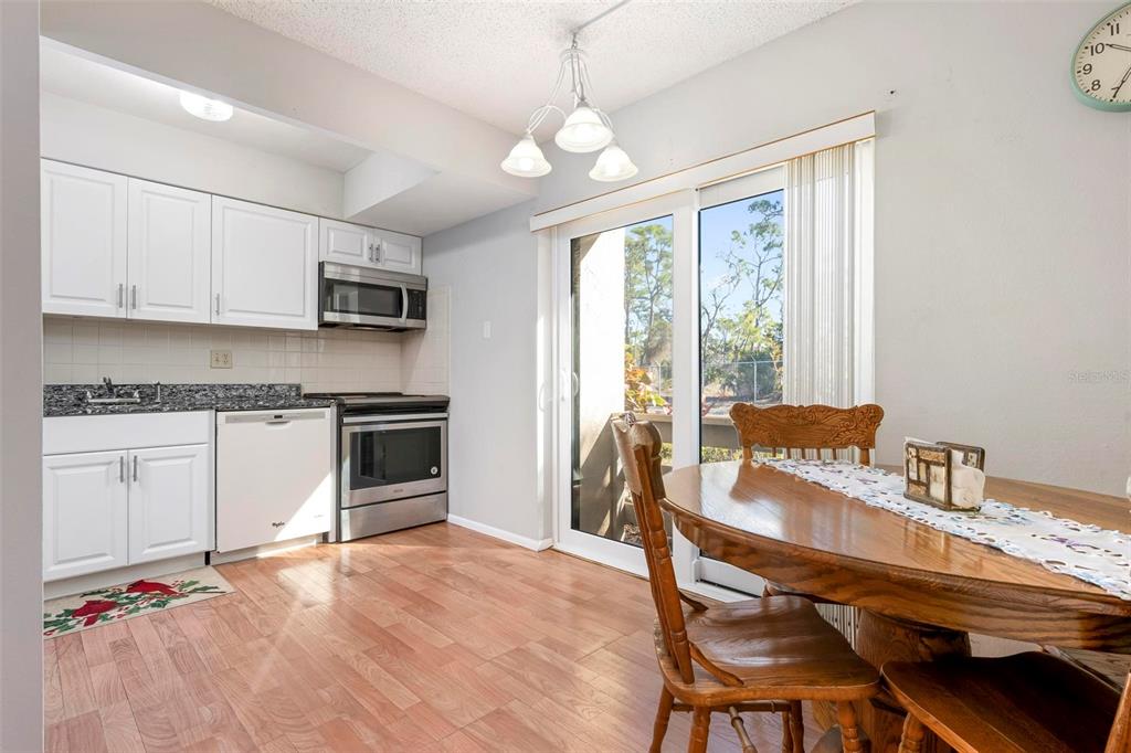 25 Quails Run Boulevard, Unit 6 Englewood, FL 34223 - Photo 17 of 31 a kitchen with a stove a sink and a refrigerator