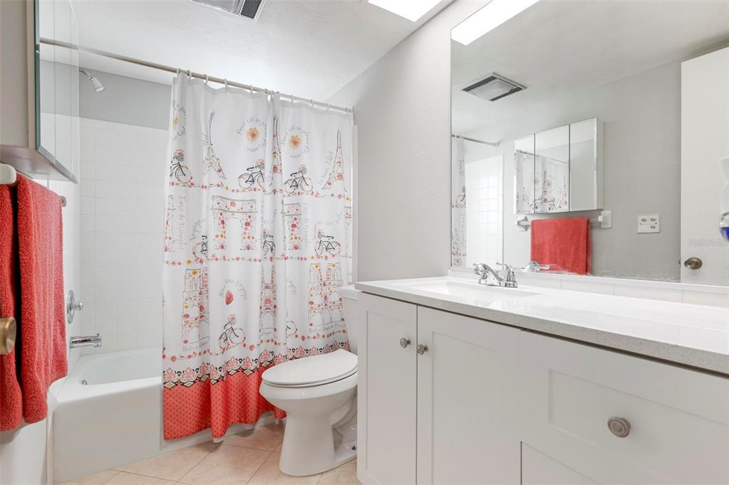 25 Quails Run Boulevard, Unit 6 Englewood, FL 34223 - Photo 22 of 31 a bathroom with a toilet sink and shower