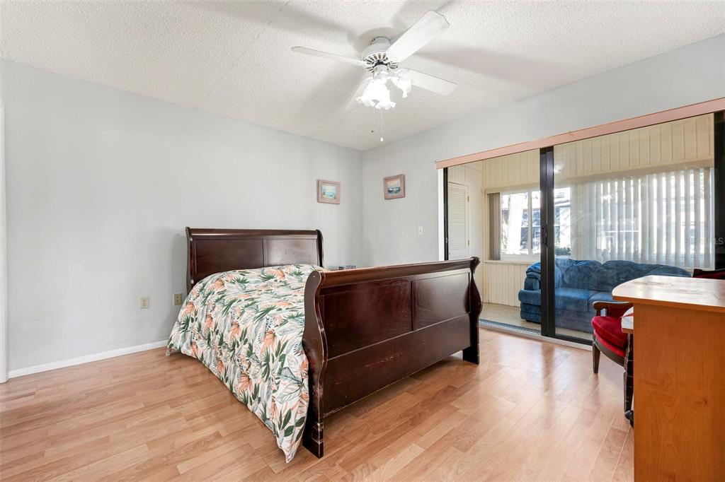 25 Quails Run Boulevard, Unit 6 Englewood, FL 34223 - Photo 23 of 31 a bedroom with bed and window