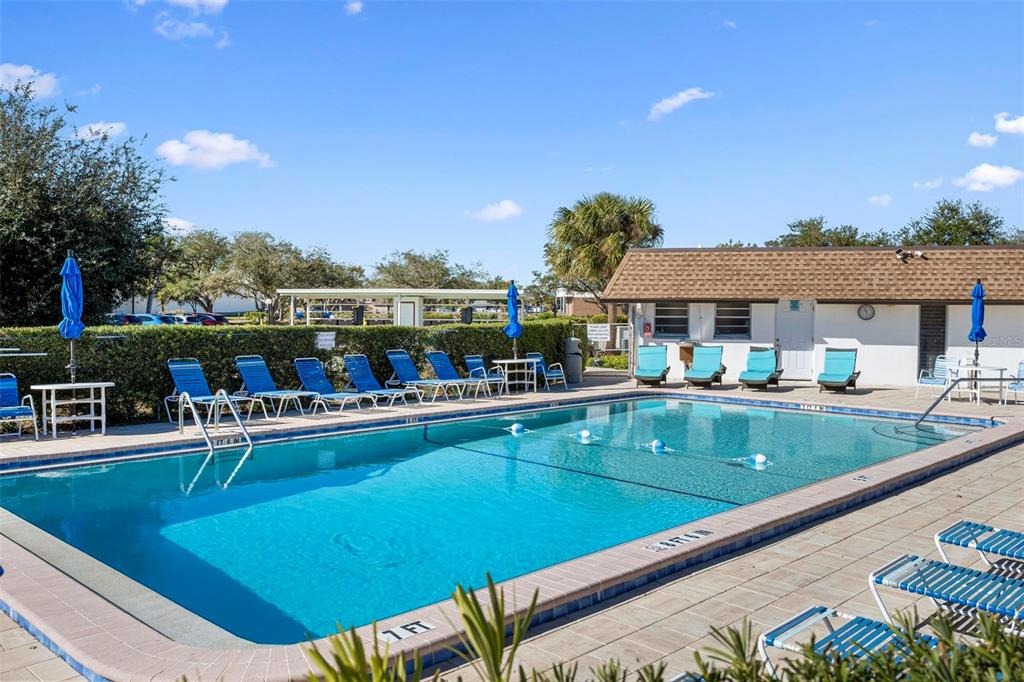 25 Quails Run Boulevard, Unit 6 Englewood, FL 34223 - Photo 29 of 31 a view of a swimming pool with outdoor seating