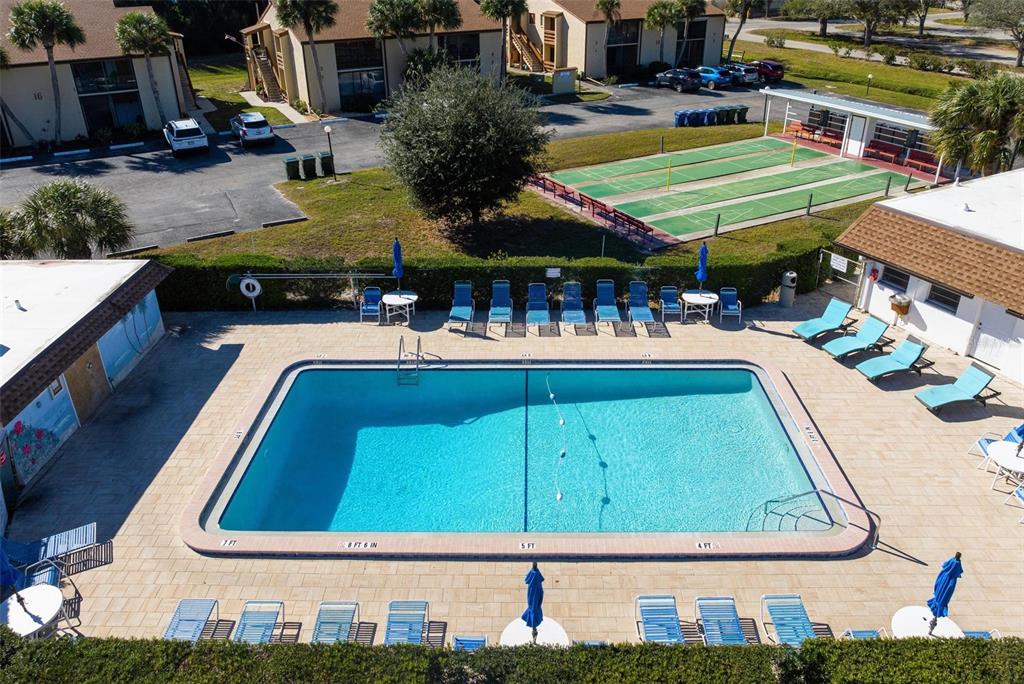 25 Quails Run Boulevard, Unit 6 Englewood, FL 34223 - Photo 31 of 31 a view of a pool with chairs