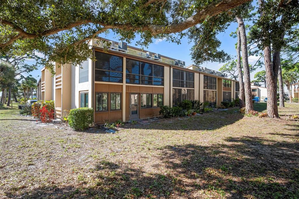 25 Quails Run Boulevard, Unit 6 Englewood, FL 34223 - Photo 4 of 31 a view of a house with a yard