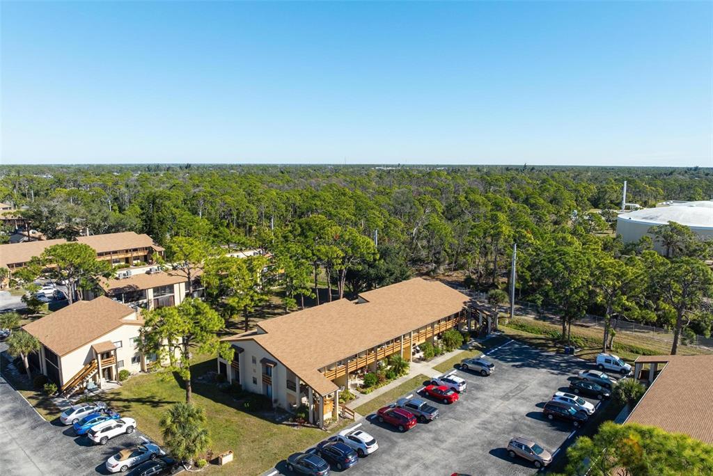 25 Quails Run Boulevard, Unit 6 Englewood, FL 34223 - Photo 6 of 31 an aerial view of a house with yard swimming pool and outdoor seating