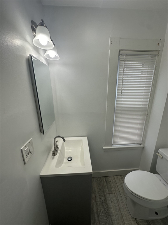 30 Clement Avenue, Unit 2 Peabody, MA 01960 - Photo 12 of 35 a bathroom with a sink a toilet and mirror