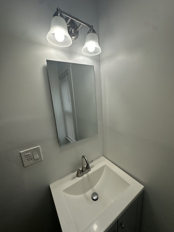 30 Clement Avenue, Unit 2 Peabody, MA 01960 - Photo 14 of 35 a bathroom with a sink and mirror