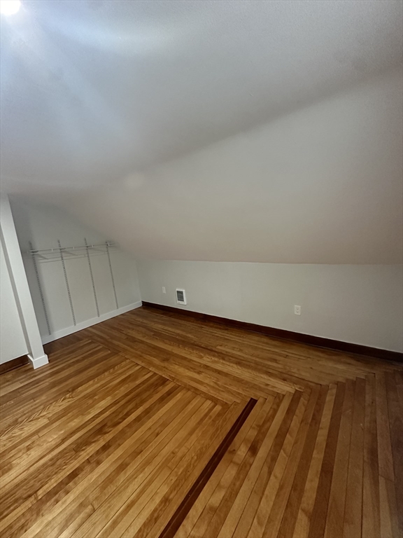 30 Clement Avenue, Unit 2 Peabody, MA 01960 - Photo 19 of 35 a view of a room with wooden floor and white walls