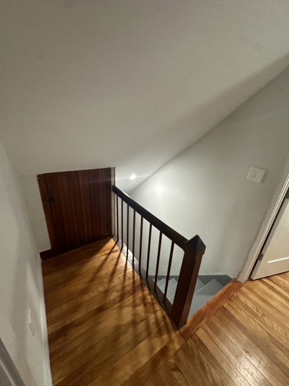 30 Clement Avenue, Unit 2 Peabody, MA 01960 - Photo 21 of 35 a view of a hallway with wooden floor and stairs
