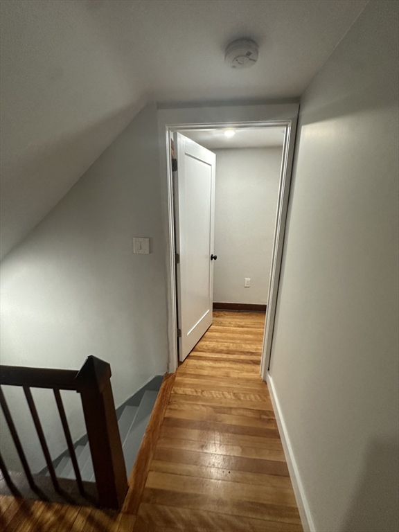 30 Clement Avenue, Unit 2 Peabody, MA 01960 - Photo 22 of 35 a view of a hallway with wooden floor and staircase