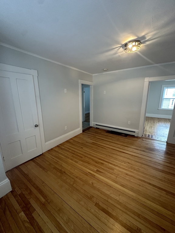 30 Clement Avenue, Unit 2 Peabody, MA 01960 - Photo 34 of 35 a view of an empty room with wooden floor