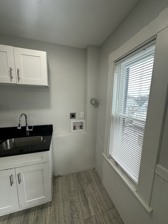 30 Clement Avenue, Unit 2 Peabody, MA 01960 - Photo 4 of 35 a kitchen with a sink a window and cabinets