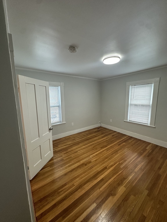 30 Clement Avenue, Unit 2 Peabody, MA 01960 - Photo 7 of 35 an empty room with wooden floor and windows