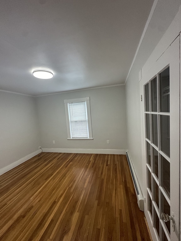 30 Clement Avenue, Unit 2 Peabody, MA 01960 - Photo 8 of 35 a view of an empty room with wooden floor and a window