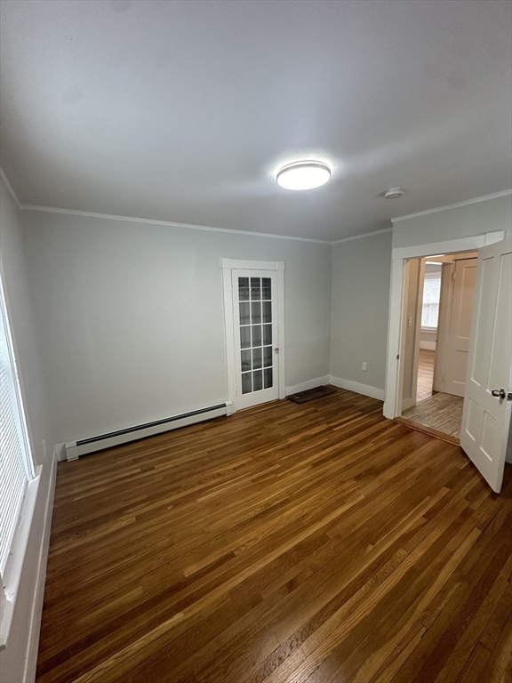 30 Clement Avenue, Unit 2 Peabody, MA 01960 - Photo 9 of 35 a view of an empty room with wooden floor and a window