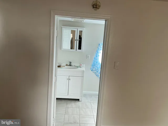 a utility room with cabinets washer and dryer