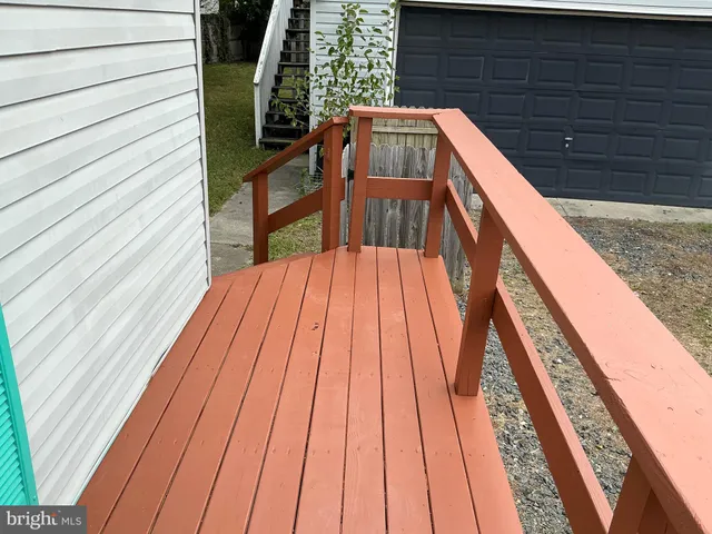 a view of balcony with wooden floor