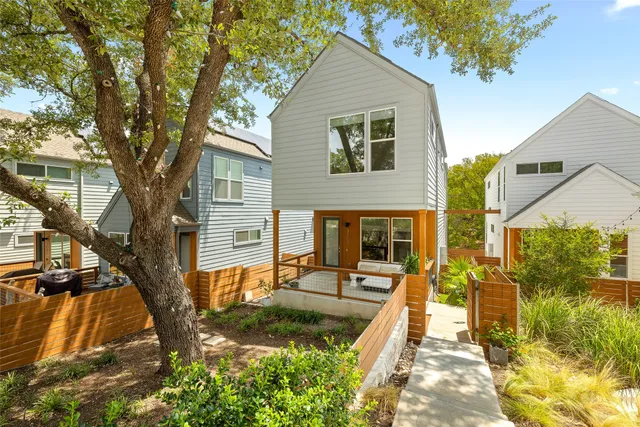 a bedroom with a bed and glass window