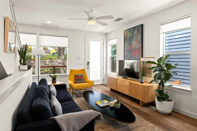 a balcony with furniture and a potted plant