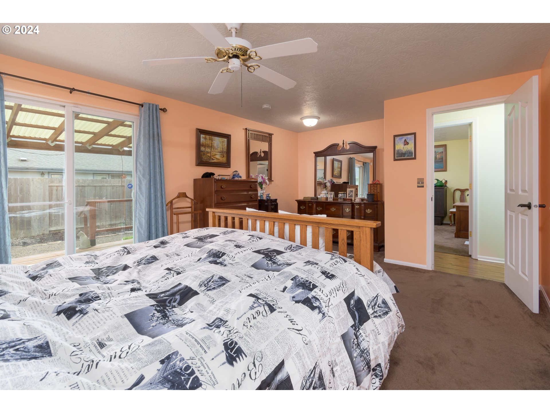 2969 Brett Loop Eugene, OR 97404 - Photo 18 of 33 a bedroom with a bed and a large window with the outer view