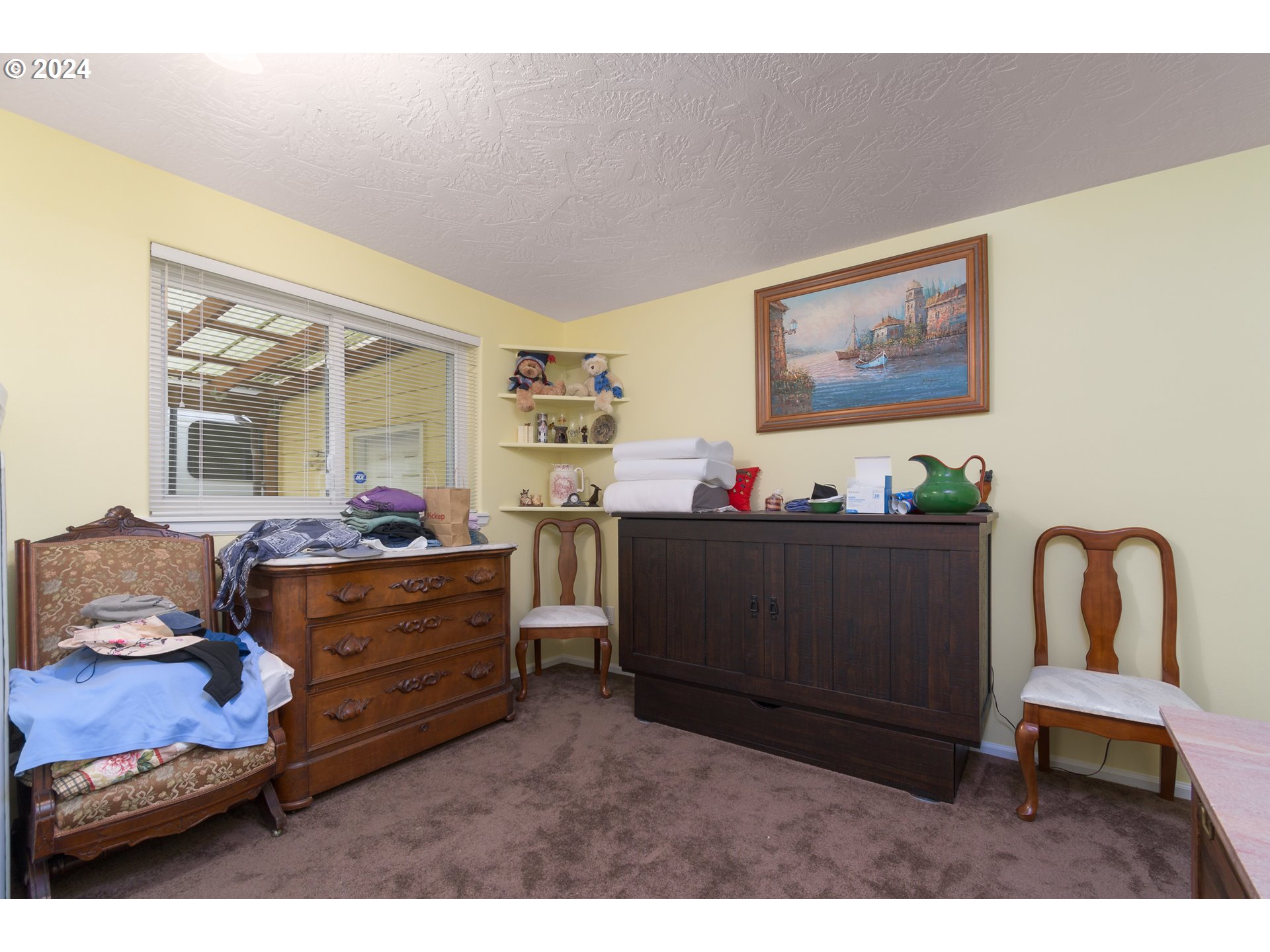 2969 Brett Loop Eugene, OR 97404 - Photo 22 of 33 a living room with furniture and paintings on the wall