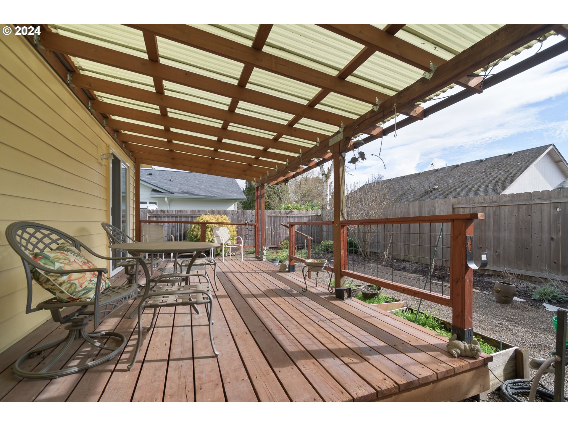 2969 Brett Loop Eugene, OR 97404 - Photo 27 of 33 a view of a backyard with wooden floor and outdoor seating