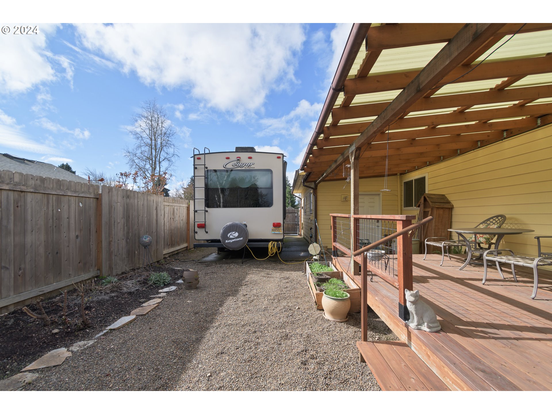 2969 Brett Loop Eugene, OR 97404 - Photo 29 of 33 a view of a backyard with furniture and a flat screen tv