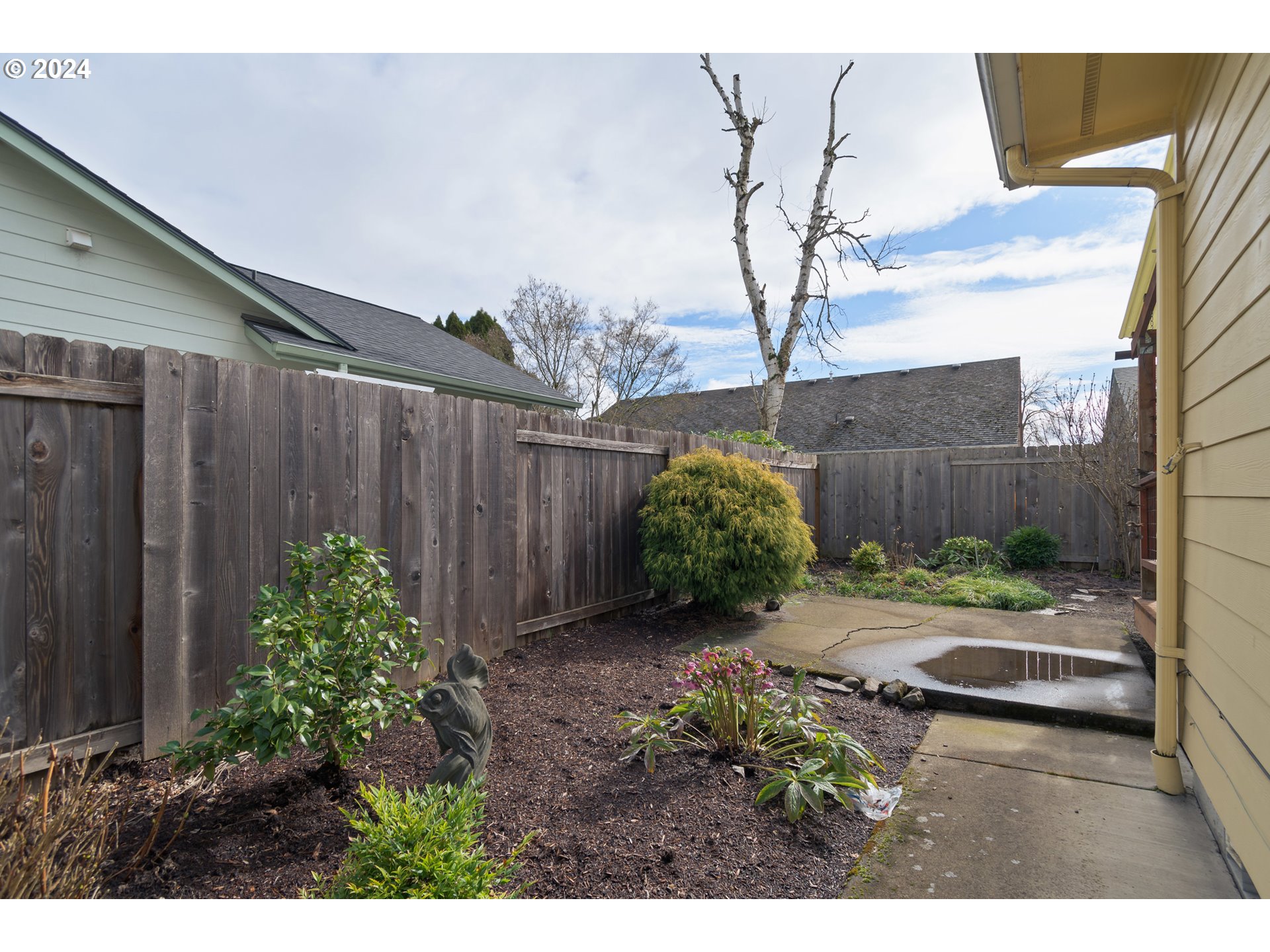 2969 Brett Loop Eugene, OR 97404 - Photo 30 of 33 a backyard of a house with lots of green space