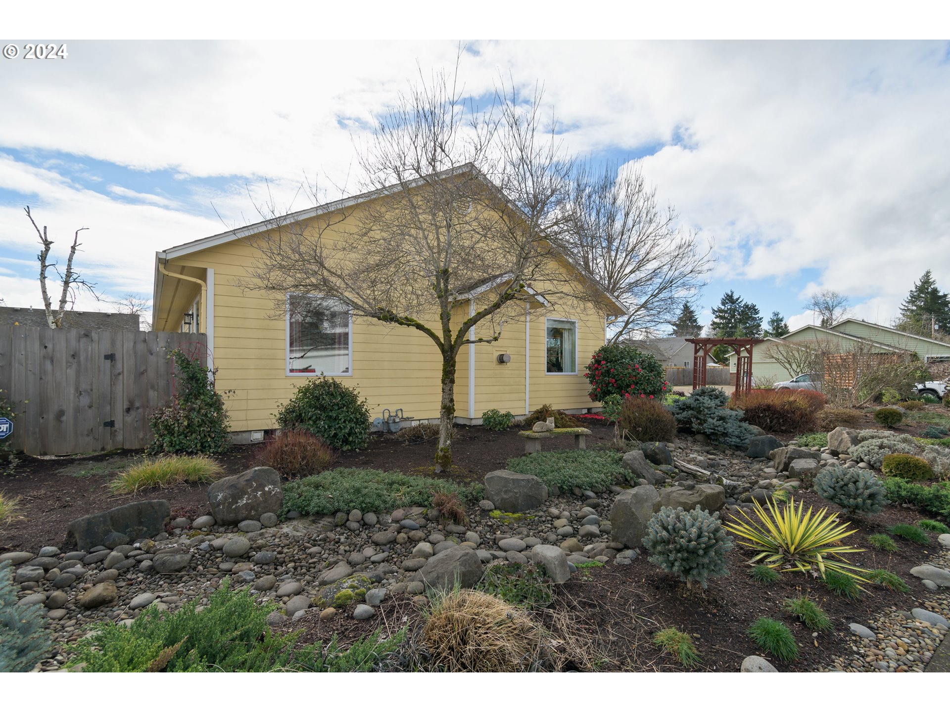 2969 Brett Loop Eugene, OR 97404 - Photo 32 of 33 a view of a house with a yard