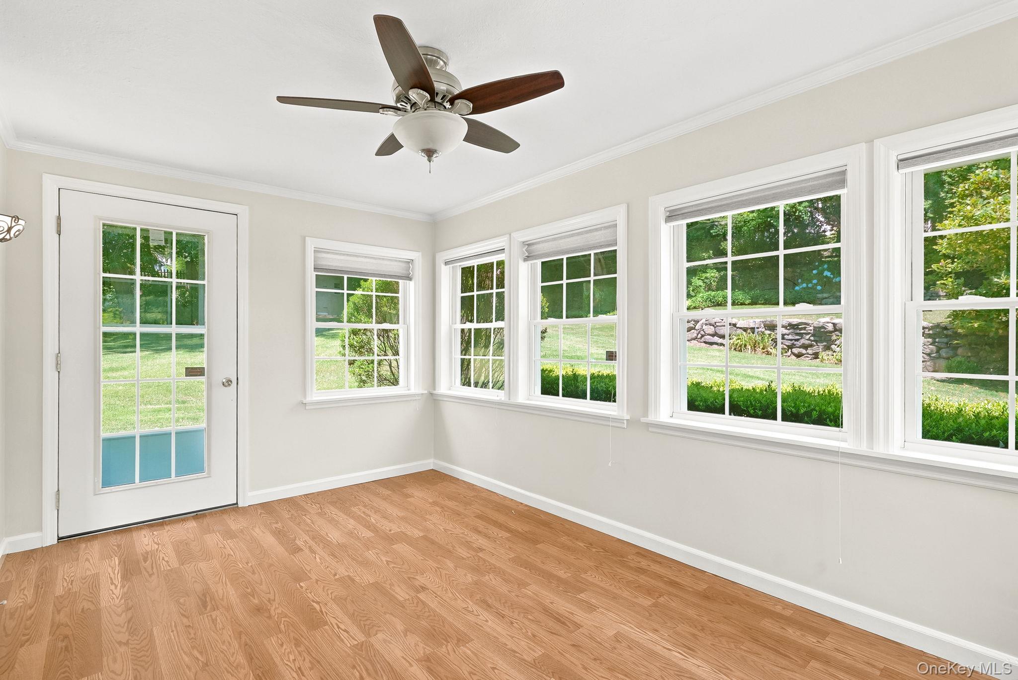 1 Sheridan Road Scarsdale, NY 10583 - Photo 7 of 40 Bright and airy sunroom with door to backyard