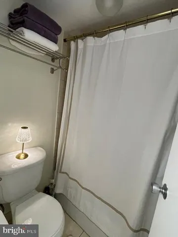 a bathroom with a glass shower door
