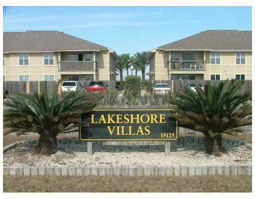 a sign that is sitting in front of a house