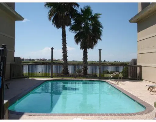 a view of swimming pool with a balcony