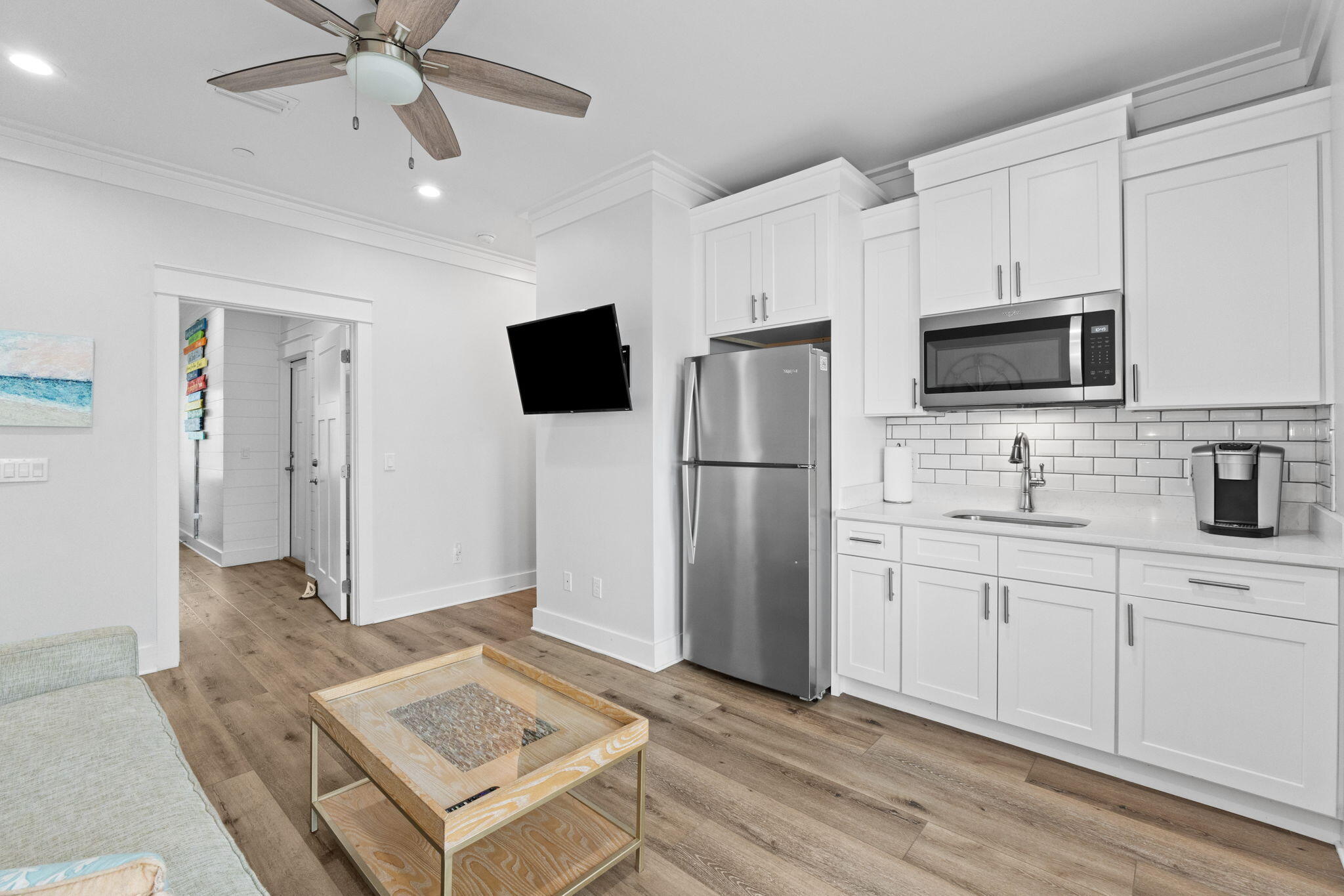 116 Riviera Drive Panama City Beach, FL 32413 - Photo 15 of 66 a kitchen with stainless steel appliances a refrigerator sink and microwave