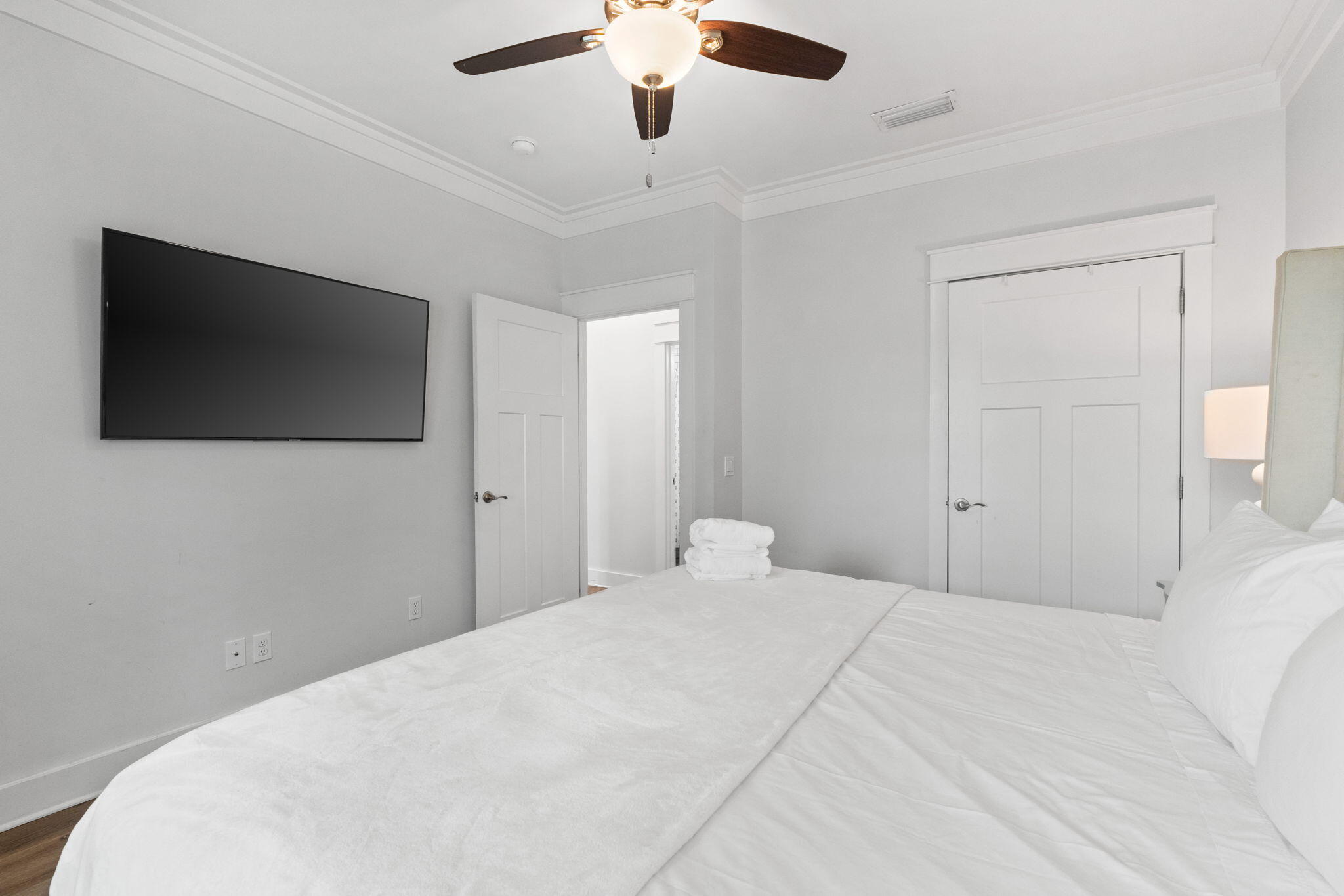116 Riviera Drive Panama City Beach, FL 32413 - Photo 22 of 66 a bedroom with a bed and a flat screen tv
