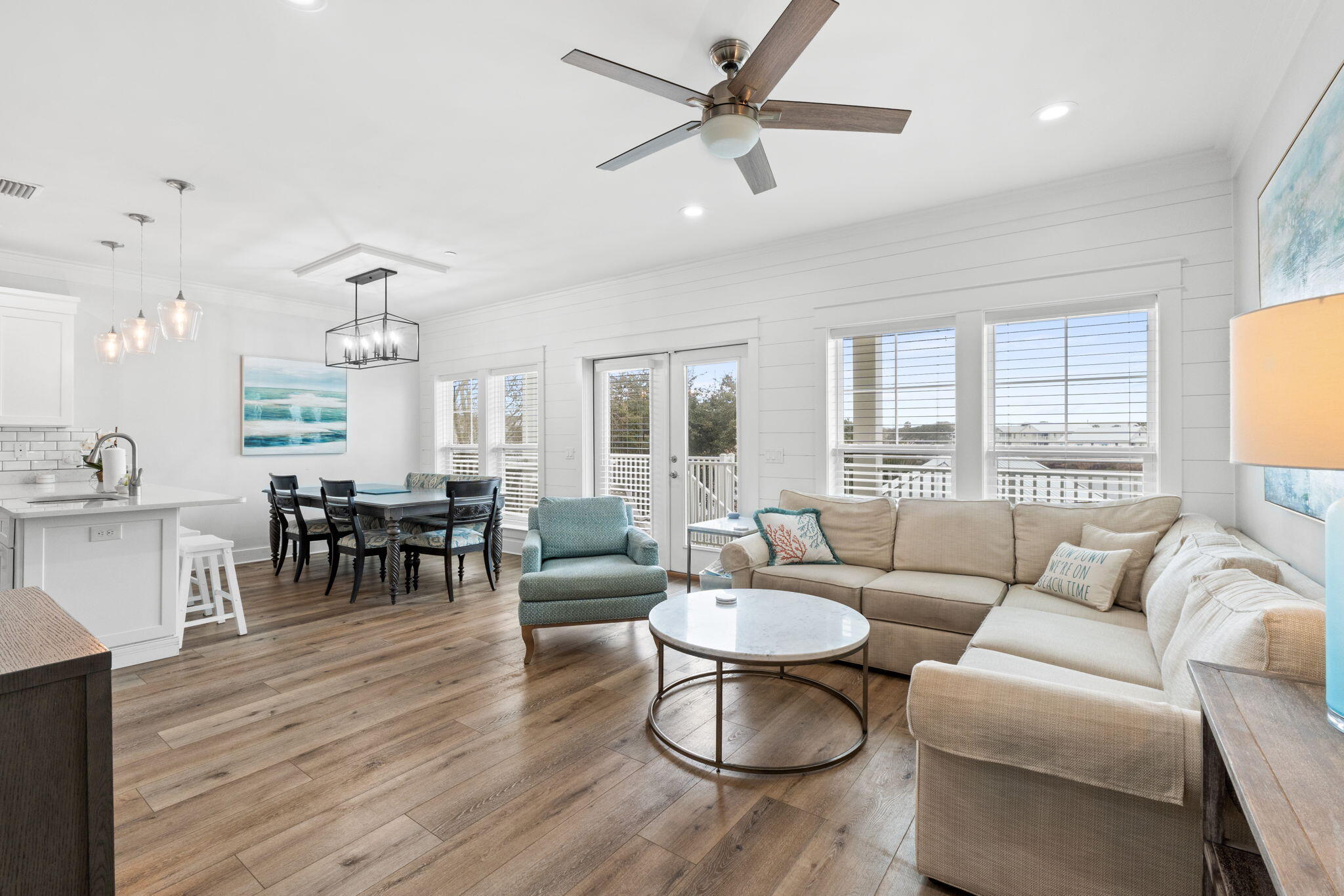 116 Riviera Drive Panama City Beach, FL 32413 - Photo 24 of 66 a living room with furniture or couch and a wooden floor