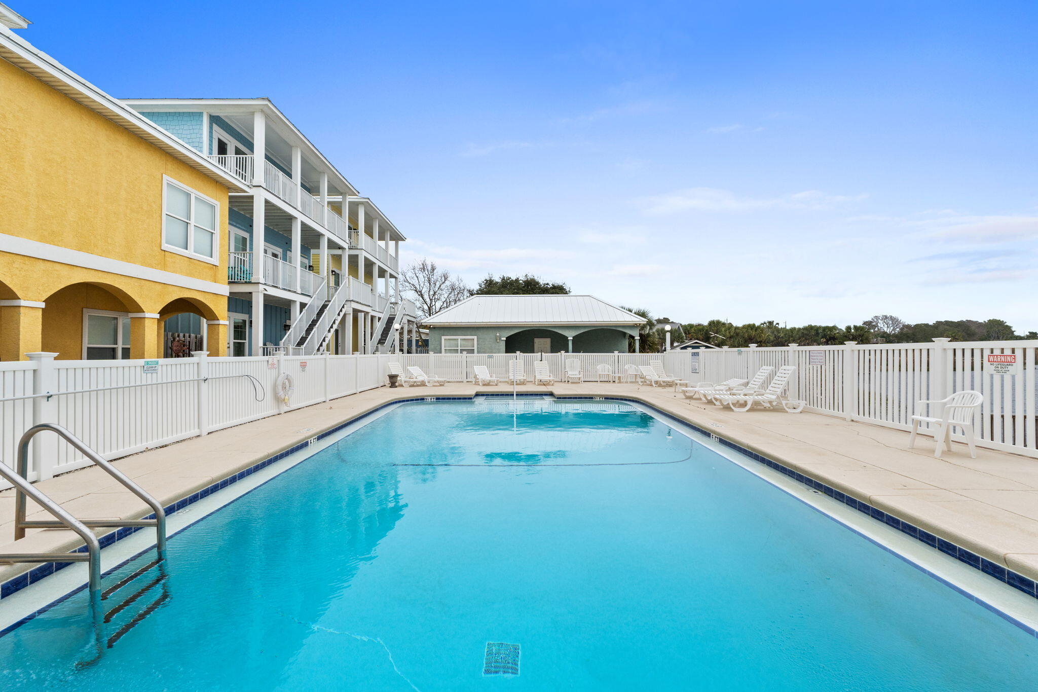 116 Riviera Drive Panama City Beach, FL 32413 - Photo 3 of 66 a view of a swimming pool with a lake view