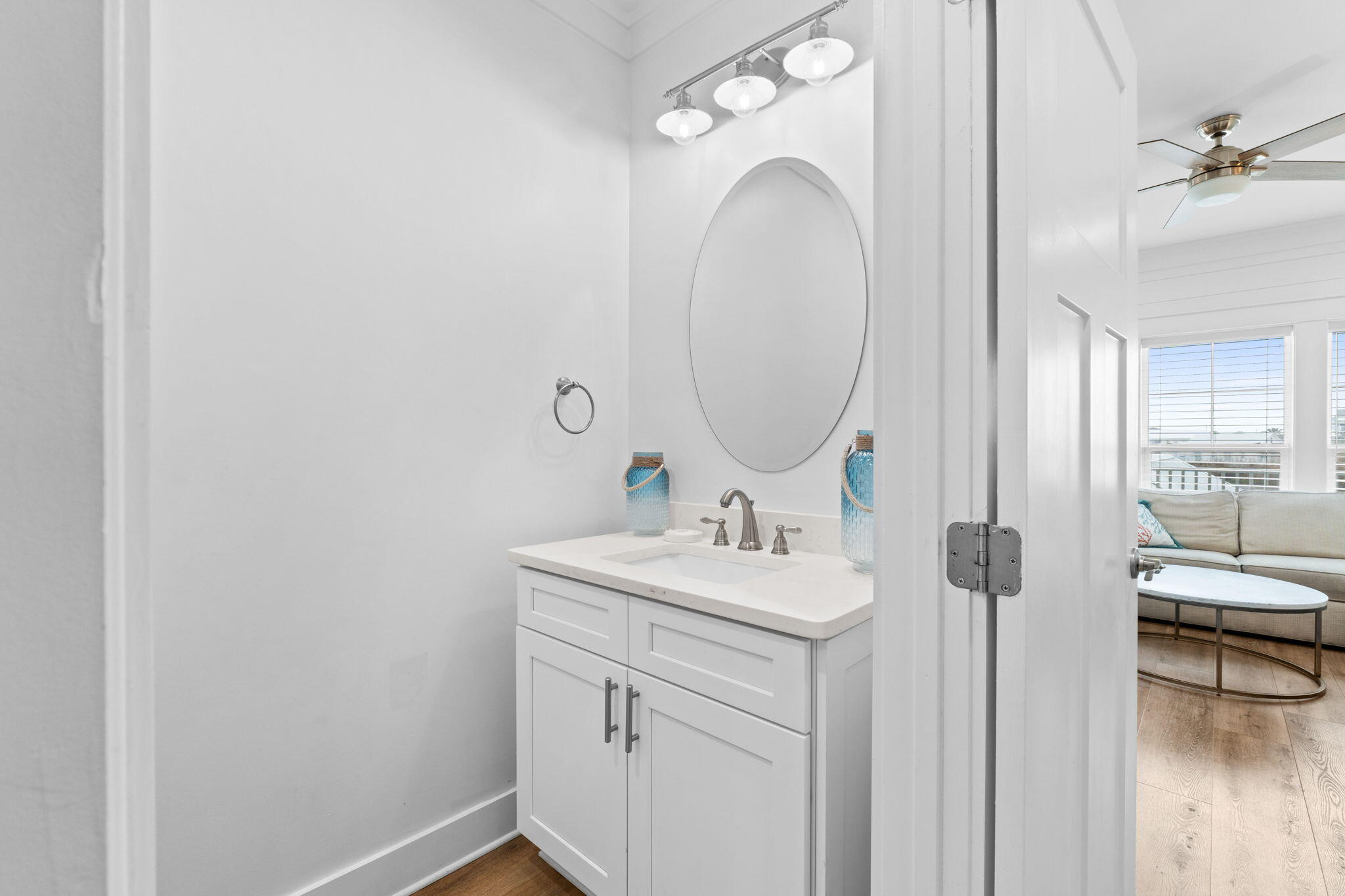 116 Riviera Drive Panama City Beach, FL 32413 - Photo 38 of 66 a en suite bathroom with a sink and a mirror