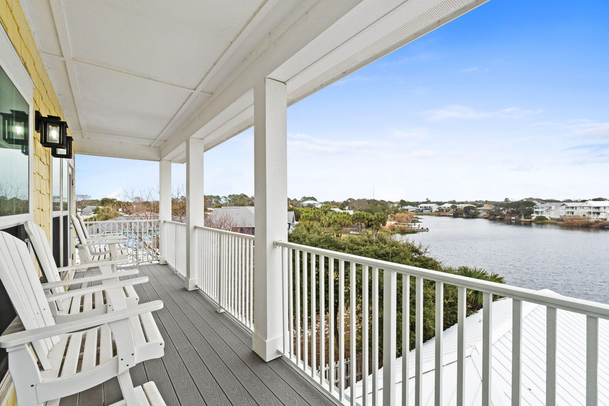 116 Riviera Drive Panama City Beach, FL 32413 - Photo 43 of 66 a view of a balcony with lake view and wooden floor