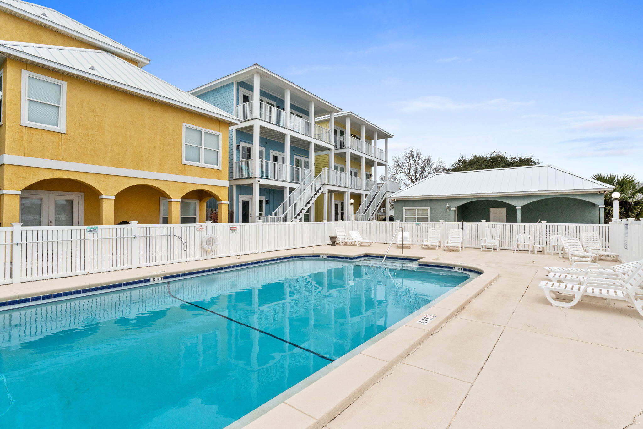 116 Riviera Drive Panama City Beach, FL 32413 - Photo 48 of 66 a view of a building with a swimming pool