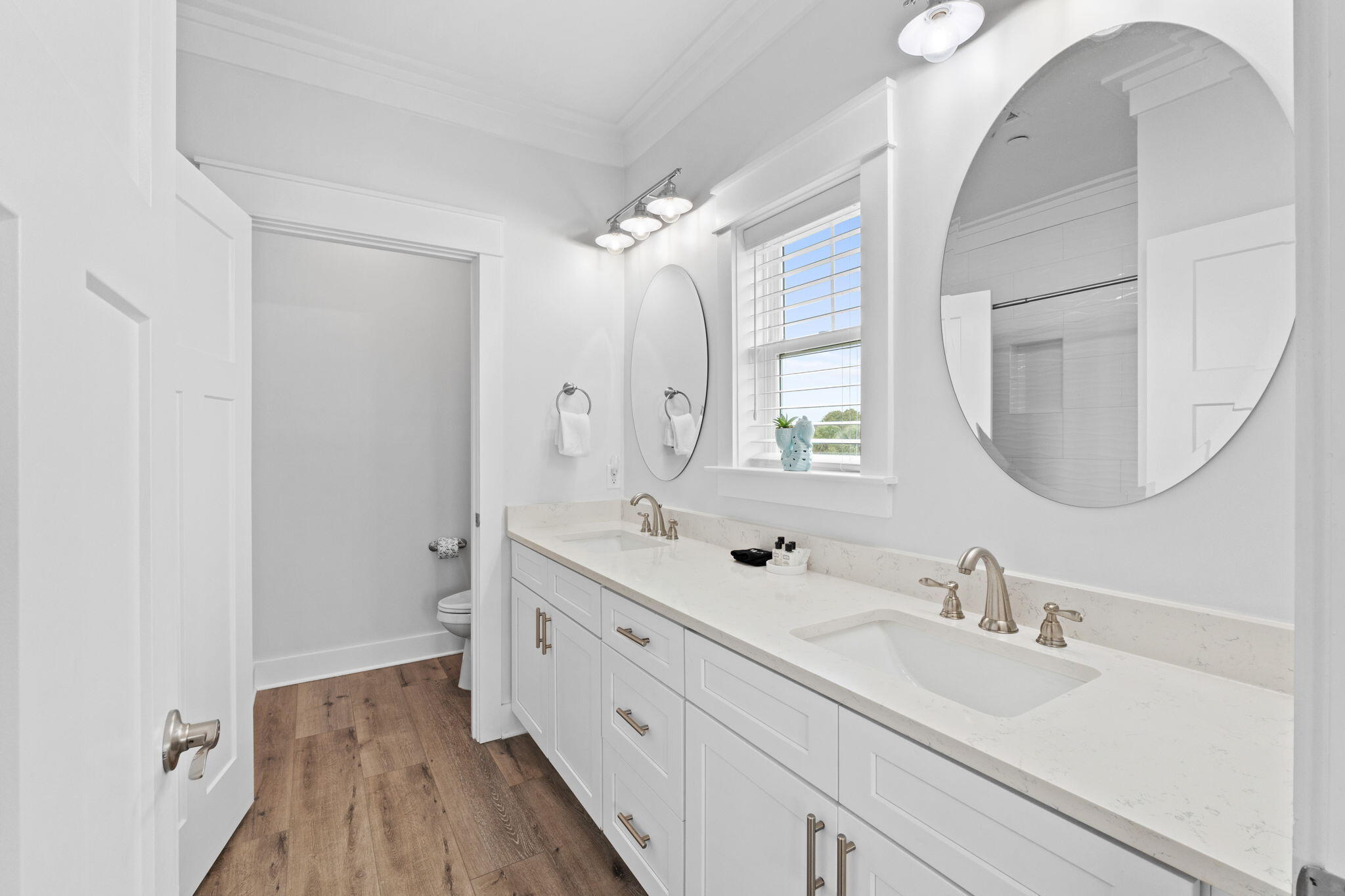 116 Riviera Drive Panama City Beach, FL 32413 - Photo 53 of 66 a bathroom with a double vanity sink mirror and a toilet