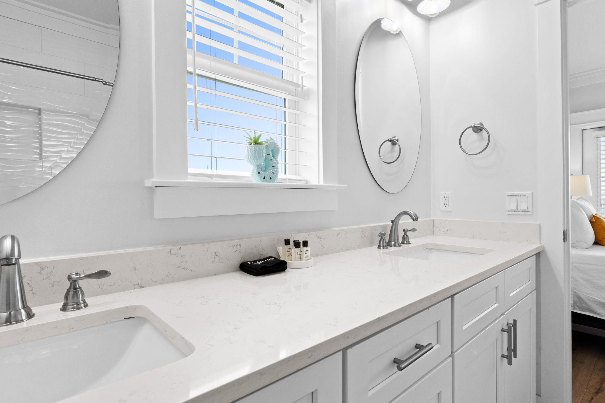 116 Riviera Drive Panama City Beach, FL 32413 - Photo 54 of 66 a bathroom with a sink and a mirror