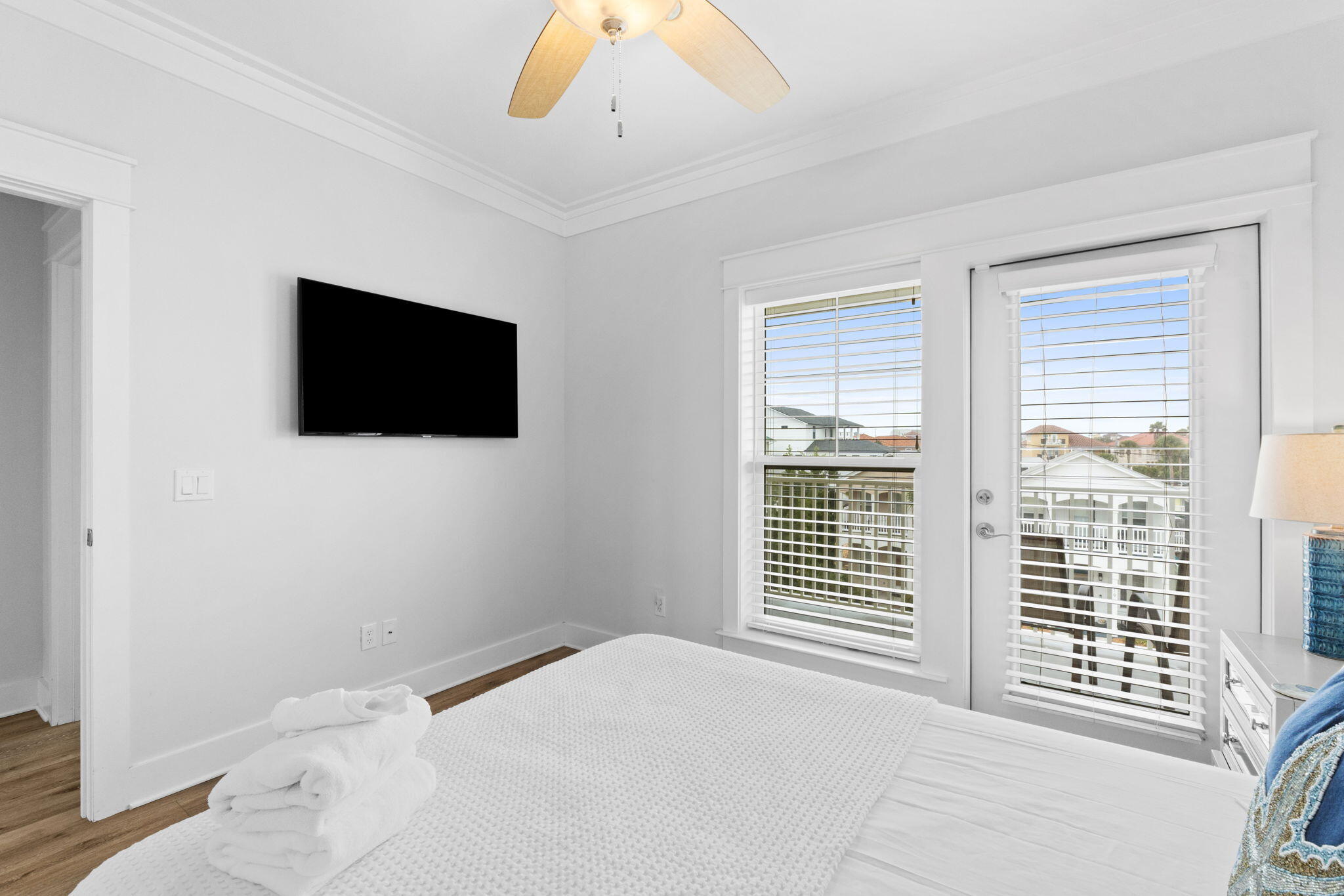 116 Riviera Drive Panama City Beach, FL 32413 - Photo 61 of 66 a bedroom with a bed and a flat screen tv