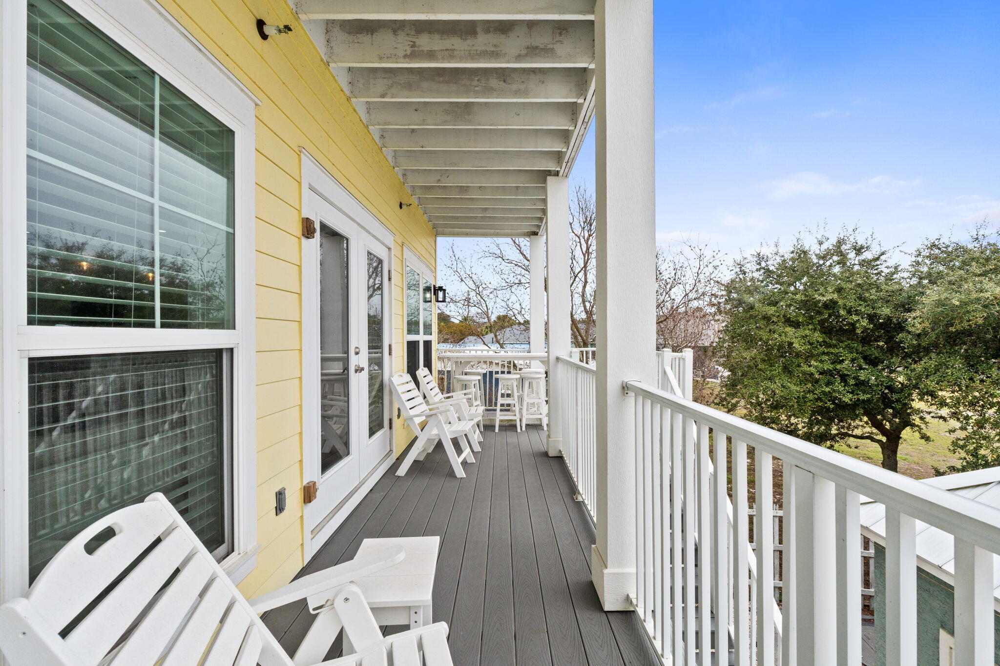 116 Riviera Drive Panama City Beach, FL 32413 - Photo 62 of 66 a view of a balcony with wooden floor