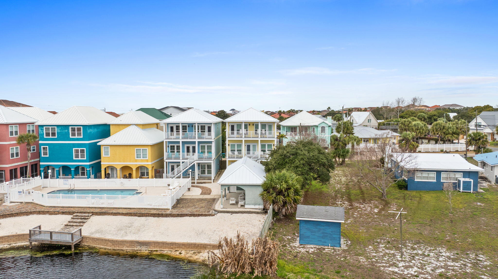116 Riviera Drive Panama City Beach, FL 32413 - Photo 64 of 66 a view of a swimming pool with a patio