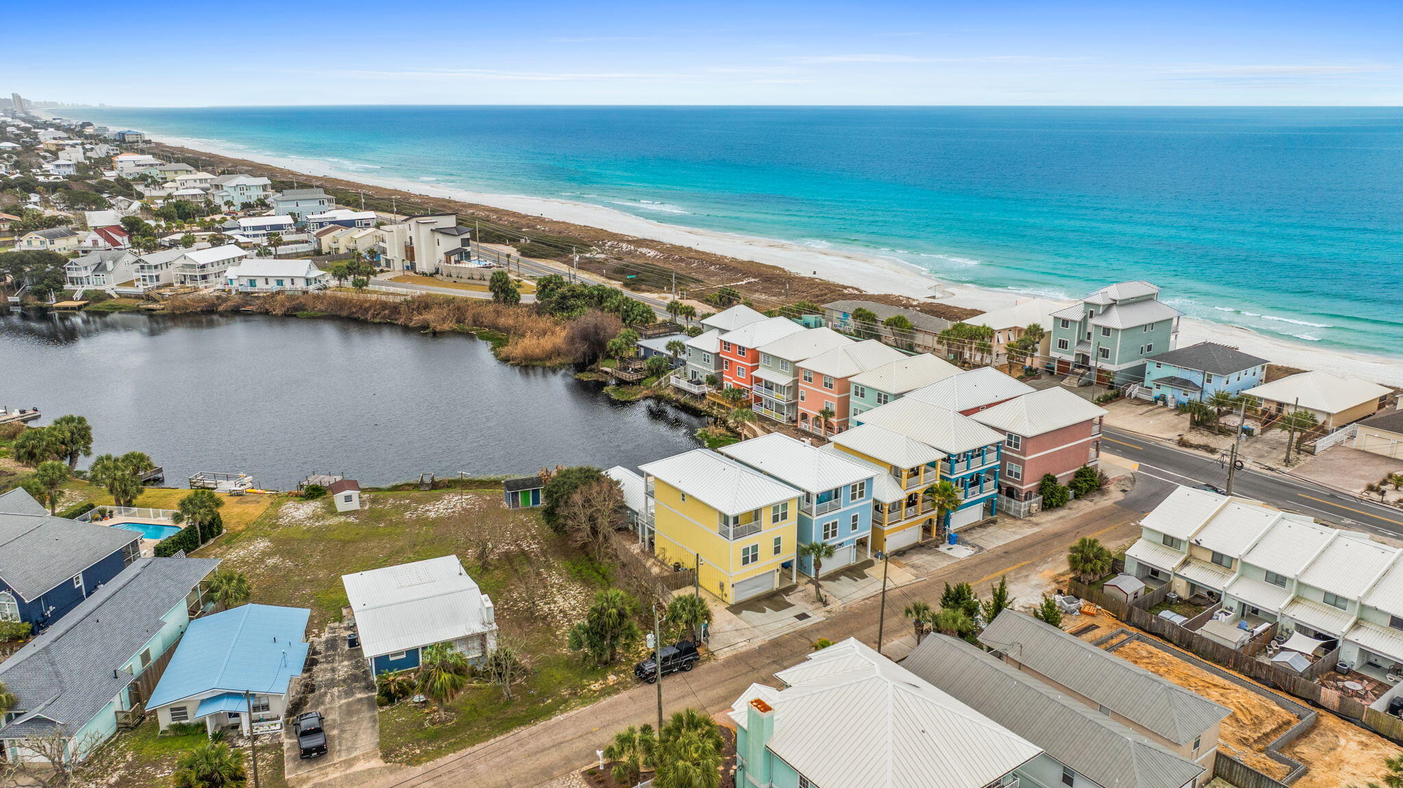 116 Riviera Drive Panama City Beach, FL 32413 - Photo 65 of 66 an aerial view of residential houses with outdoor space