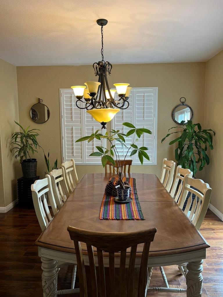 2436 Crooked Trail Road Chula Vista, CA 91914 - Photo 11 of 47 a view of a dining room with furniture and wooden floor