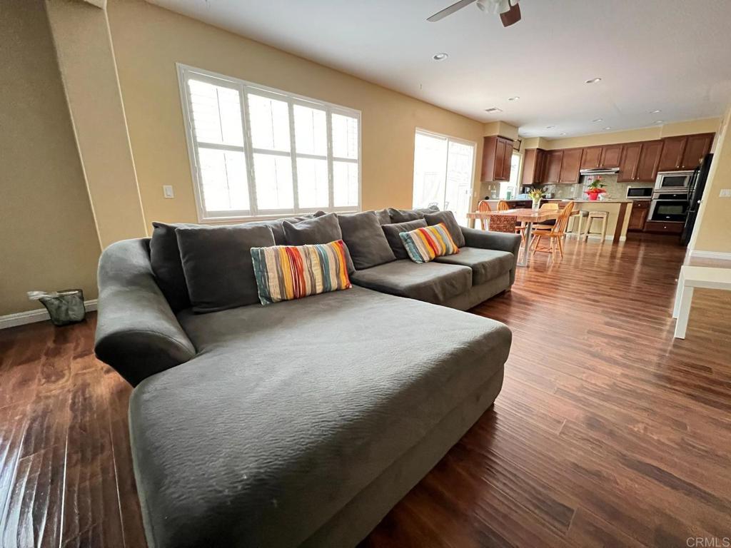 2436 Crooked Trail Road Chula Vista, CA 91914 - Photo 13 of 47 a large bedroom with a bed and wooden floor