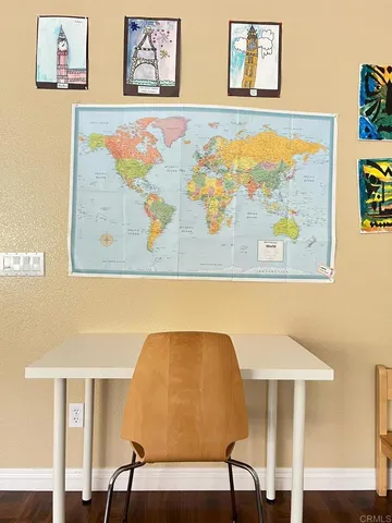 a view of a livingroom with furniture hardwood floor and windows